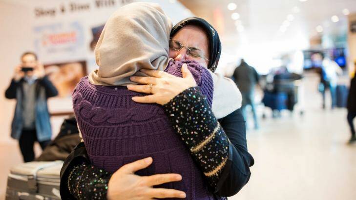 Sahar Harati, left, who moved from Iran to the US, embraces her mother as her parents arrive at Logan International Airport in Boston last week. Photo: New York Times
