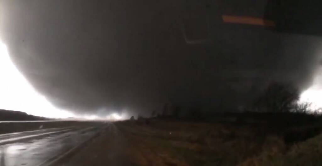 Video footage shows the tornado bearing down on Sam Smith's car.