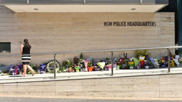 Flowers outside NSW Police headquarters in 2015, in tribute to Curtis Cheng. Photo: Steven Siewert