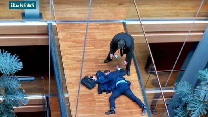 ITV grab of Steven Woolfe sprawled face-down on a Strasbourg parliament walkway. Photo: ITV News