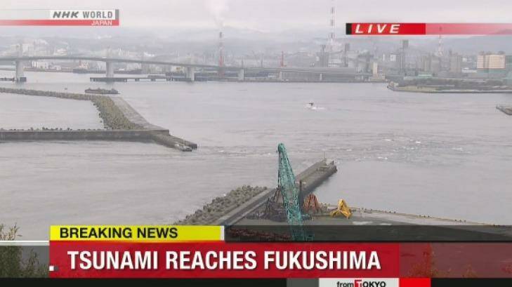 The water is seen rushing out to sea at Port of Onahama.  Photo: NHK