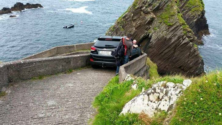 The vehicle was wedged in the walkway overnight, forcing the local ferry company to cancel services.  Photo: Facebook 