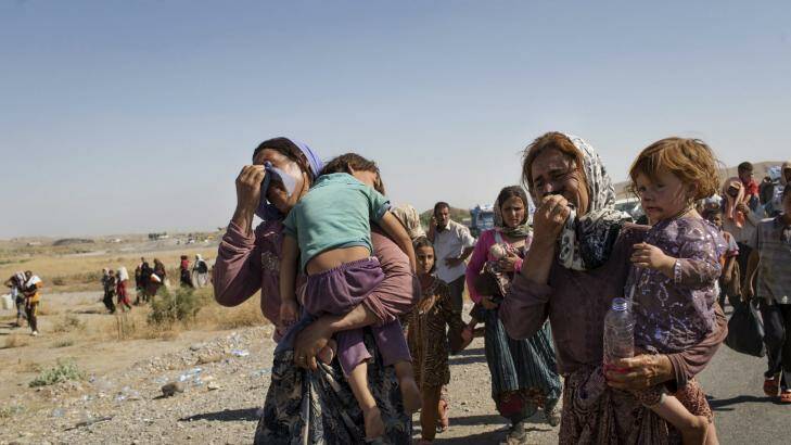 A photo of Iraqi Yazidi people who fled their homes in Sinjar, taken by Adam Ferguson. Photo: Adam Ferguson/The New York Times
