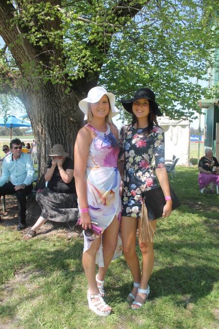 FASHION ICONS: Coota girls Jordan Fuller and Stacey Boxsell at the Cootamundra Racecourse today.