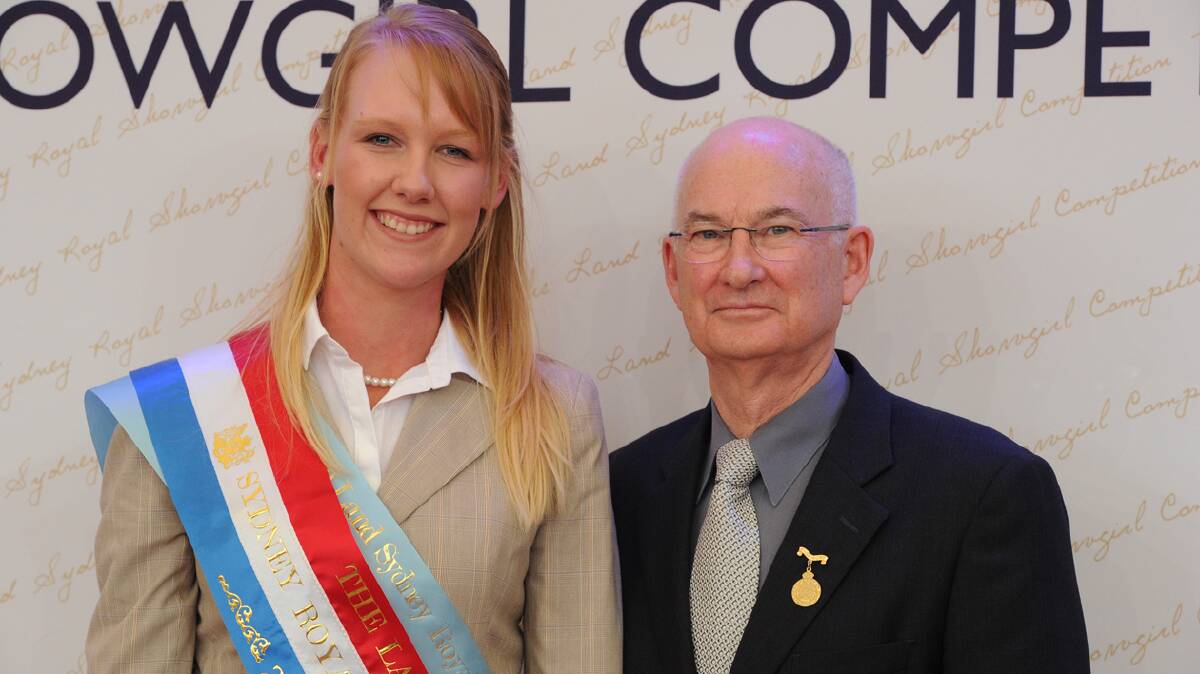 WELL DONE: 2014 The Land Sydney Royal Showgirl Brodie Chester is pictured with Royal Agricultural Society of NSW president, Geln Dudley.

Photo: The Land 