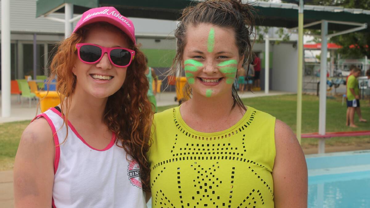  SWIM FANS: pictured (left) is Kiera White and Holly Meadows at the Cootamundra High School swimming carnival yesterday. Holly ended up breaking eight records on the day.