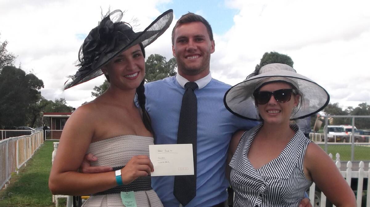 FASHION WINNERS:
This stylish couple Shae and Adam Meusburger, of Shellharbour, were the winners of Best Dressed Couple at the Picnic Races, and their prize, a generous donation from Len and Liz of The White Ibis, dinner for two there.
Also pictured with Shae and Adam is their good friend Hannah Pigram.