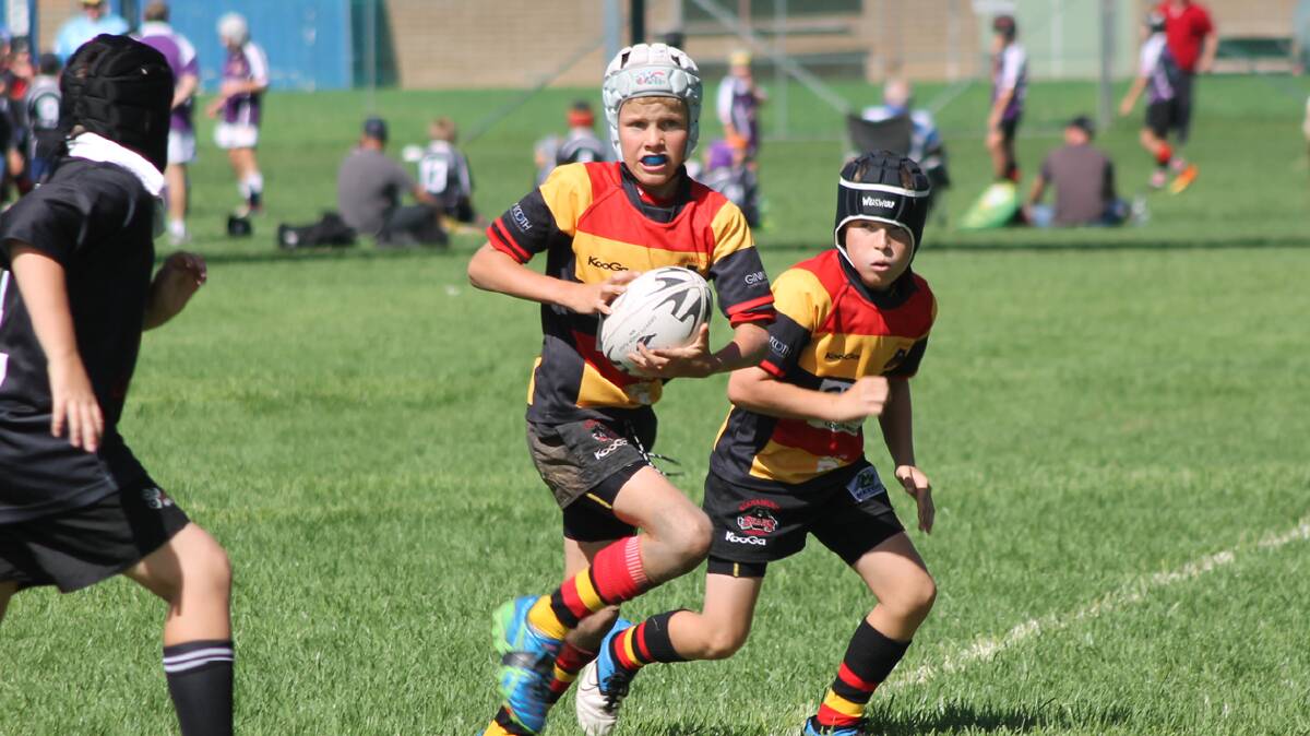  QUICK FOOTED: Cootamundra Junior Rugby Union Club’s Ritchie Tooth sprints away during an under 11s match at the Bears’ Gala day on Sunday. 

