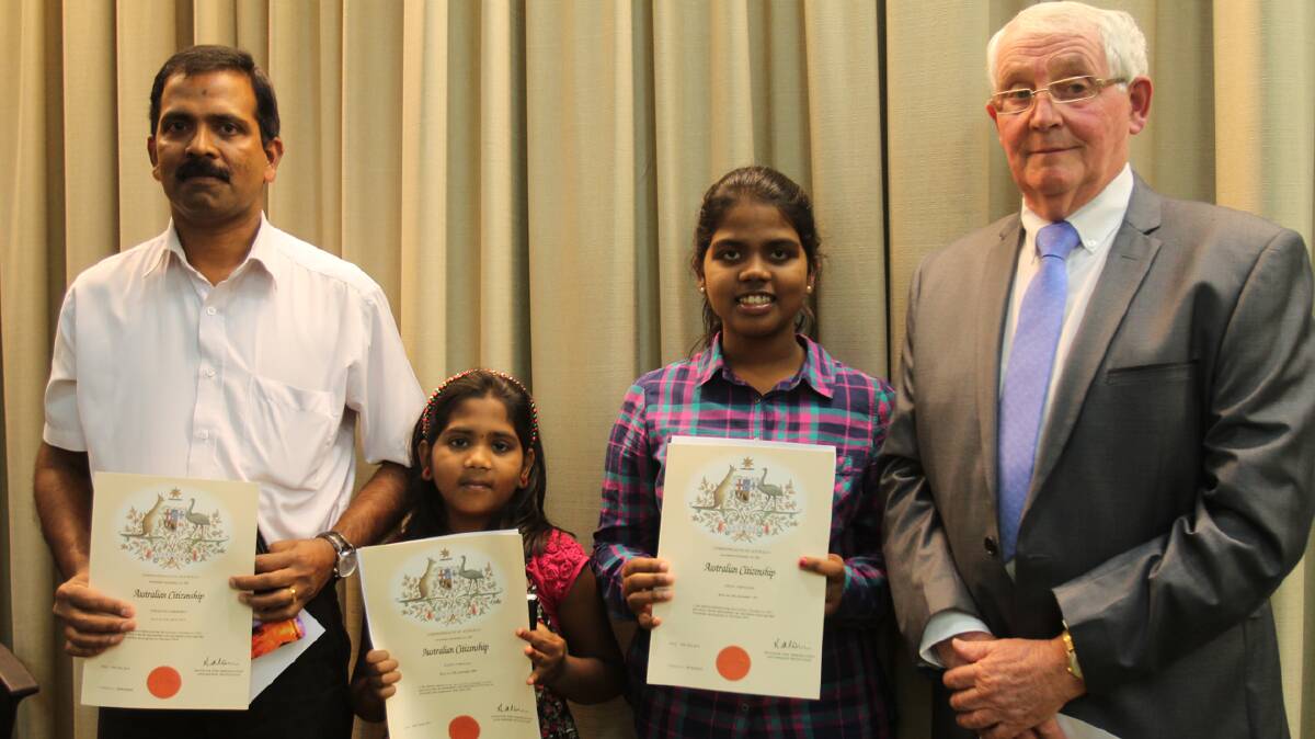 CONGRATULATIONS: Celebrating becoming Australian Citizens with Cootamundra Shire Council Mayor Jim Slattery at the council meeting on Monday night were Lawrence Tibusious, Grace Tibusious and Hanna Tibusious. The ceremony took place prior to the meeting.

