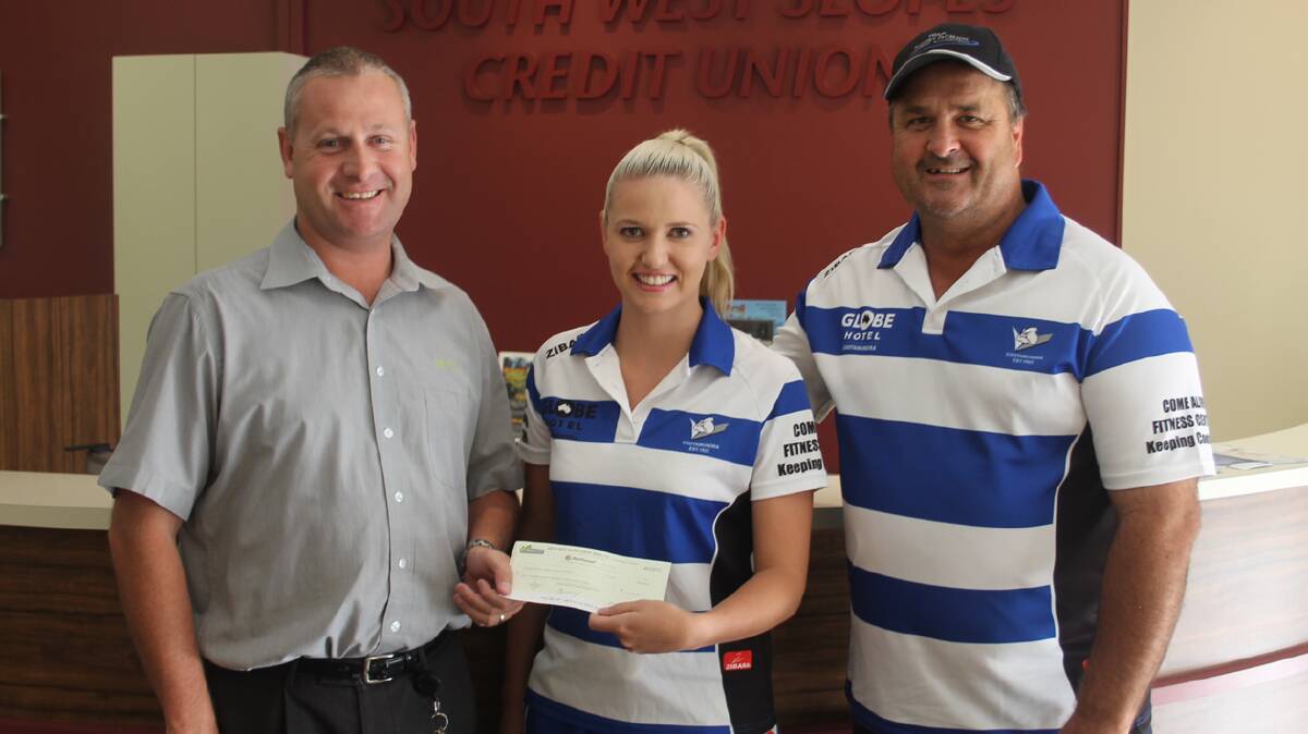 WITH THANKS: Pictured handing over a major sponsor’s cheque to the Cootamundra Rugby League Club are (from left) South West Slopes Credit Union’s Scott Meale, Bulldogs leaguetag coach and committee member Ashlea Dobson and Bulldogs president Wayne Berkrey. 