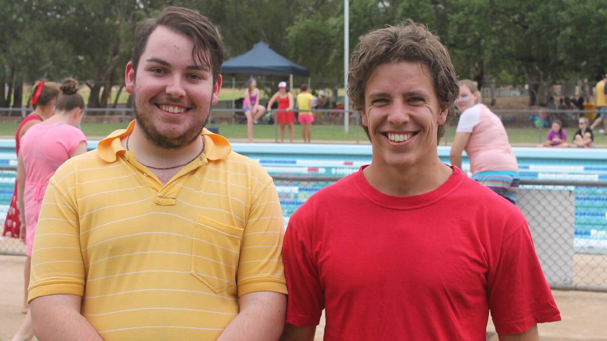 ALL SMILES: Cootamundra High School captain Thomas Worthington (left) takes a break poolside with Andrew Clements.