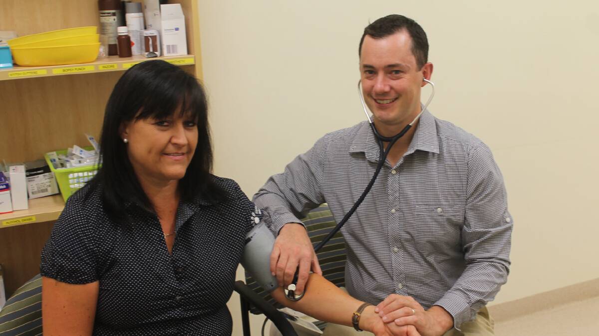 CALLING COOTA HOME: Cootamundra Medical Centre’s newest general practitioner Dr Dan Fry checks the blood pressure of practice manager Lee Loiterton.  