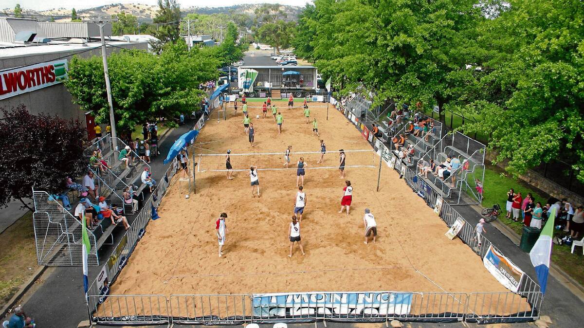 LOADS OF ACTION: This photo of the dual courts in 2006 once again shows just how unique the Coota Beach Volleyball Carnival is. Eight years on and there will be six courts this weekend. 