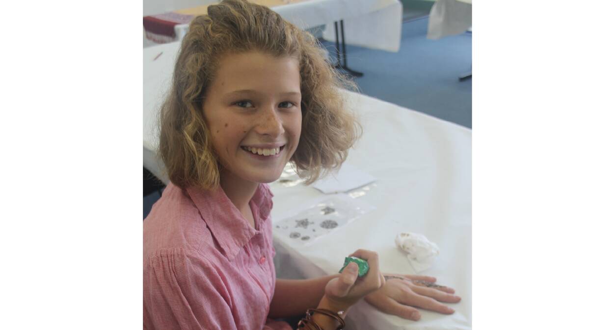 CREATIVE: Abbey Hamilton is pictured enjoying the Henna and Body Art Workshop at the Cootamundra Library this week. The workshop was part of the library’s school holiday program. 

