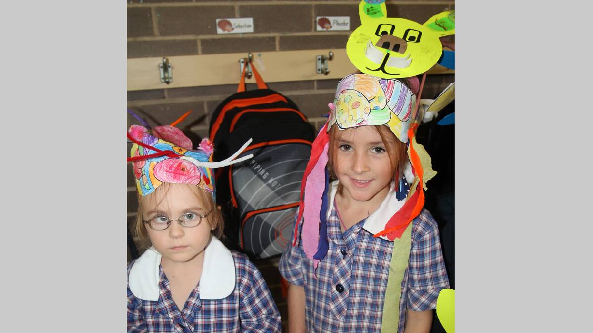 READY TO PARADE: Sacred Heart Central School kindergarten students Ashlee Peacey and Nellie Ward show off their Easter hats before the hat parade last week.

