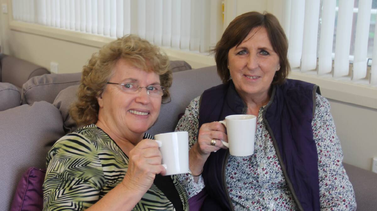 CUPPA FOR A CAUSE:
Enjoying a cuppa at the “Shower” at Wattle Grove’s Community Hall this week for the Cootamundra Nursing Home Sprinkler Appeal were June Holland and Val Hughes.
