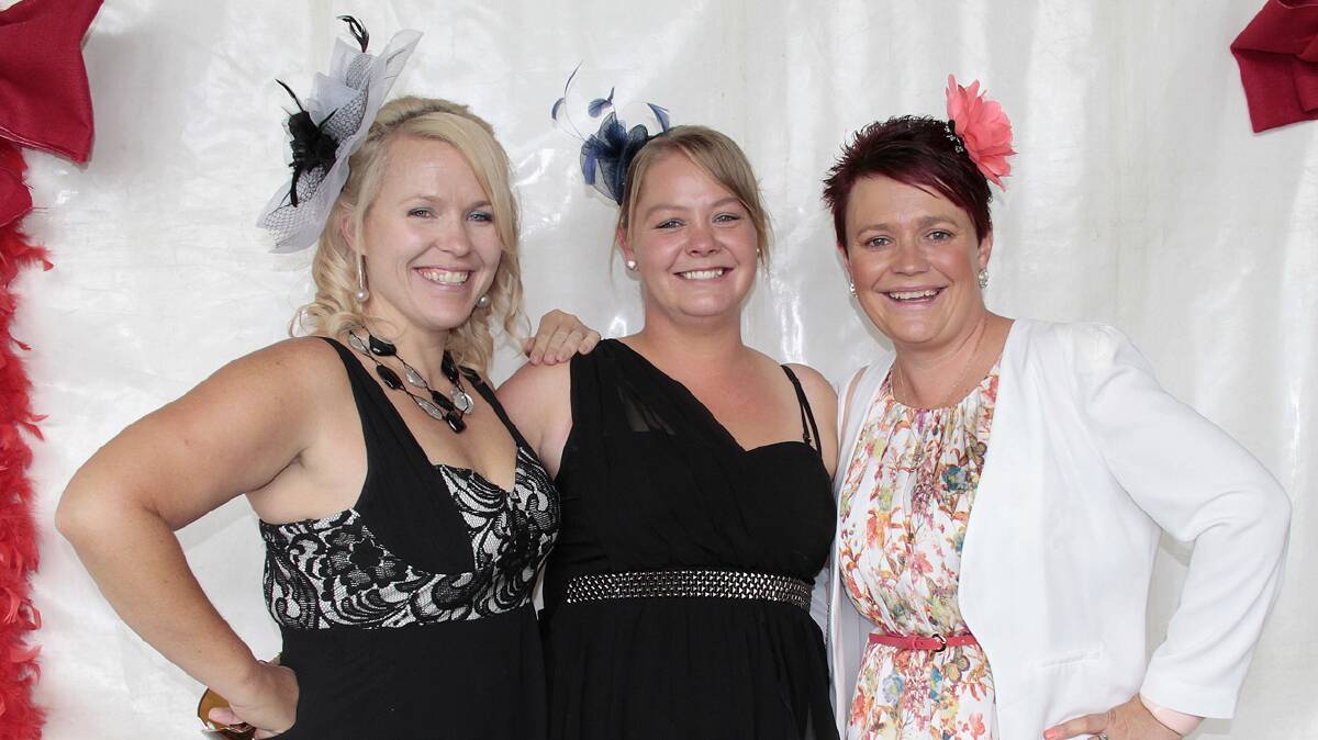 COLOURFUL: Taking a break in the marquee at Saturday’s Cootamundra Picnic Races were Catherine Annetts, Keryn Bell and Kellie Paterson.