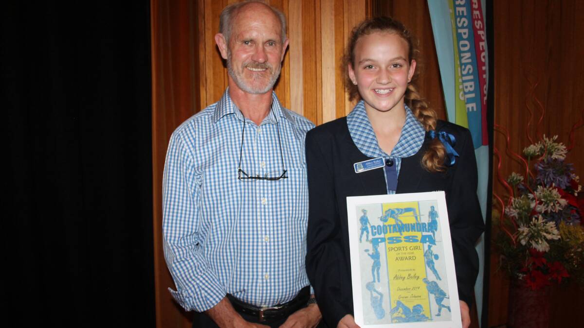 HIGHEST ATTAINMENT: Year 5/6 teacher Graeme Johnson presented Cootamundra and District PSSA Sportswoman of the Year Abbey Bailey with the award at the Cootamundra Public School presentation day on Friday. Bailey had her Year 6 graduation last night and will attend high school at Sacred Heart, no doubt continuing to represent her home town and region with pride in many sporting arenas .
