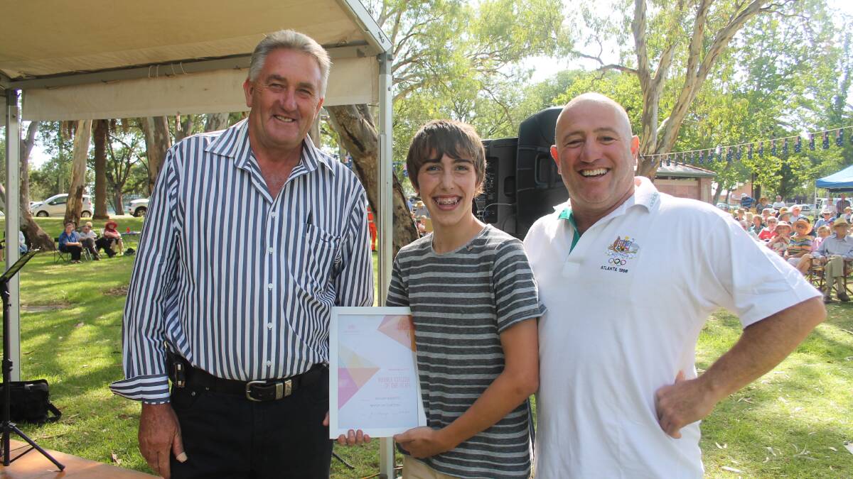 AN HONOUR: Cootamundra’s William Roberts accepts his Young Citizen of the Year Award from deputy mayor Dennis Palmer and 2015 Ambassador Rick Timperi. 
