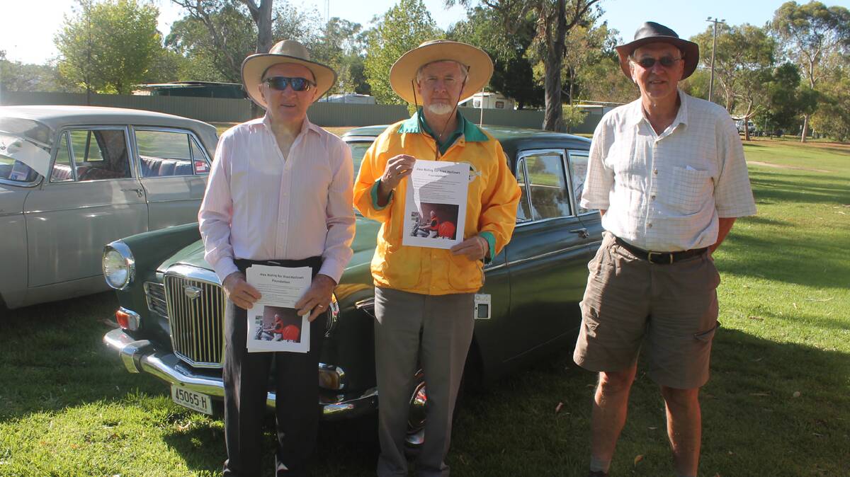  FINE MACHINERY: Checking out the vintage car displays while promoting an upcoming charity ride to be completed by Alex Sutherland were (from left) Alex who belongs to the Cootamundra Restorers Club, John Collins and John Milnes, both of the Cootamundra Antique Motor Club. 