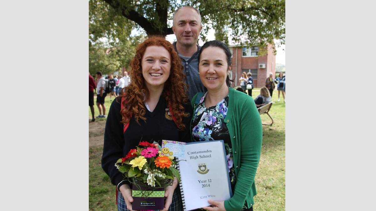 FAREWELL: Year 12 student Kiera White (left) farewells Cootamundra High School on Thursday with her parents Greg (centre) and Debbie White.