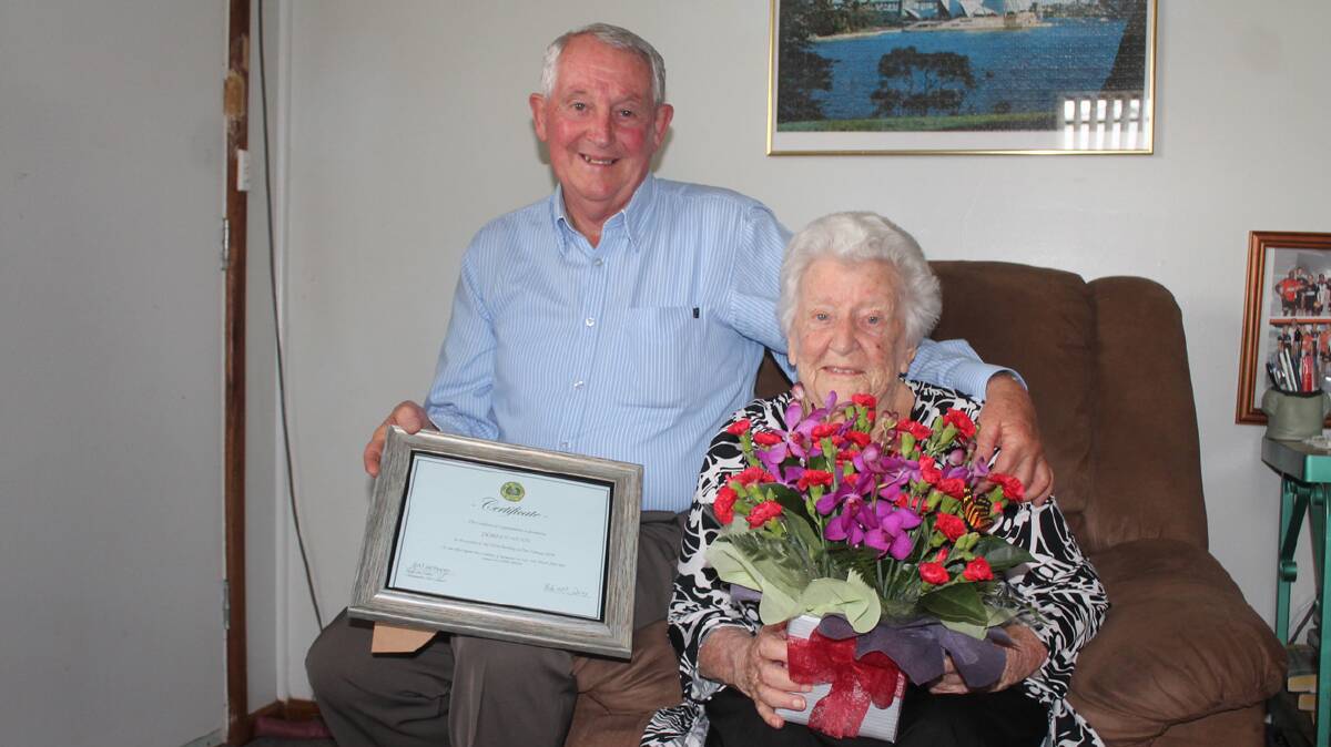 HAPPY BIRTHDAY: Cootamundra mayor Jim Slattery presents Doreen Gunn with a 
certificate and gorgeous bunch of flowers in honour of her 102nd birthday on Friday. 