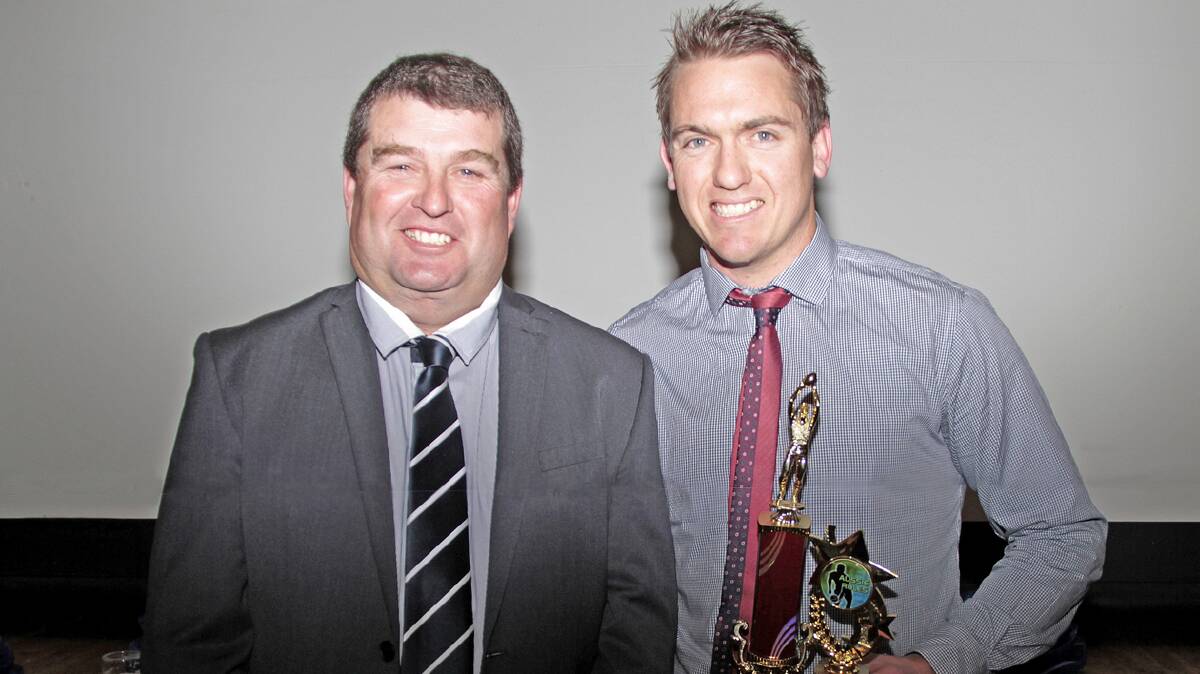  WHAT A SEASON: Luke Webb (right) accepts the Best and Fairest runner-up trophy from Cootamundra Blues president Todd Basham at the Blues presentation night last Friday. After a stunning season with the club, Webb has decided to move on to the next challenge and is bound for Cairns. 
Photo: Kelly Manwaring 
