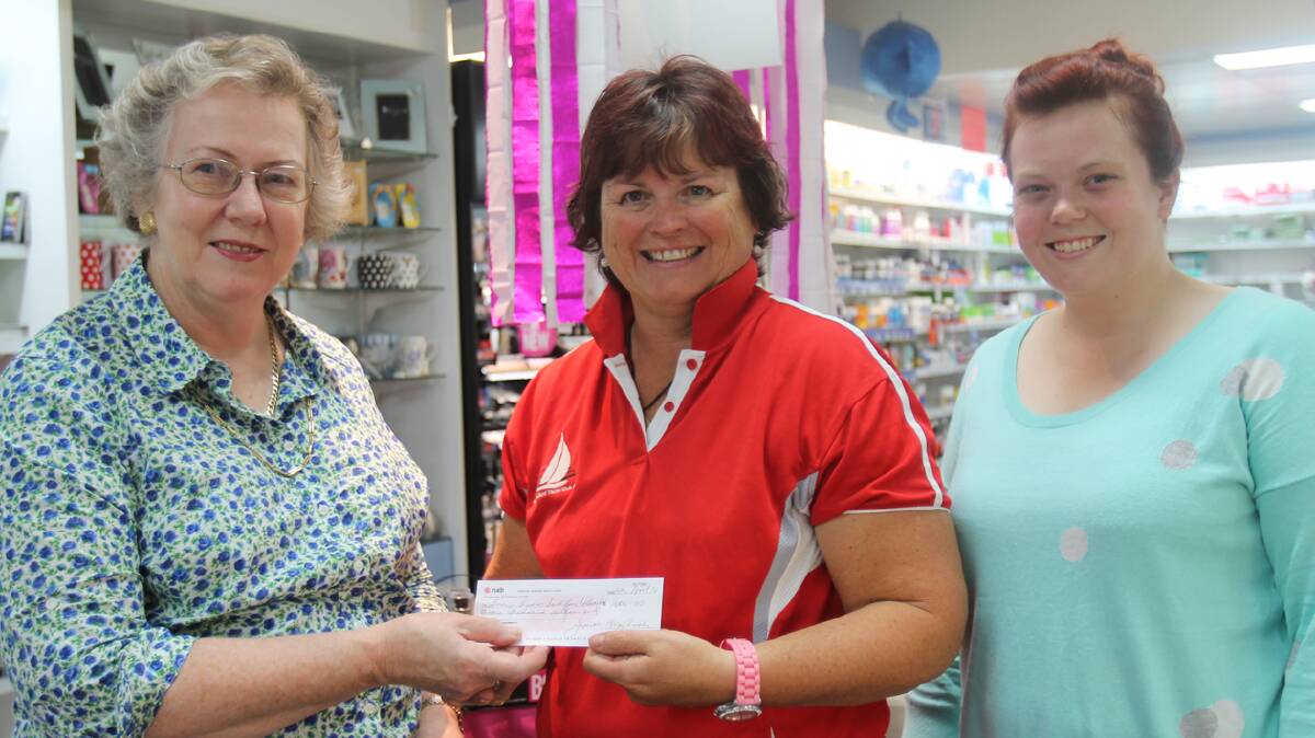 CHALLENGE:
Braybrooks Pharmacy’s Judy Braybrooks has put out the challenge to Cootamundra businesses to donate to the Snowy Hydro SouthCare.
Daughter Fiona Braybrooks raised $500 from a Jelly Bean in a jar guessing competition, with the pharmacy matching it to take its donation to $1000.
Mrs Braybrooks urges businesses to think of innovative ways to raise money for this worthy cause, adding you never know when you or your family will need to use the 
service.   
Mrs Braybrooks and Fiona are pictured presenting a cheque to fundraising volunteer Di Williams (centre).
