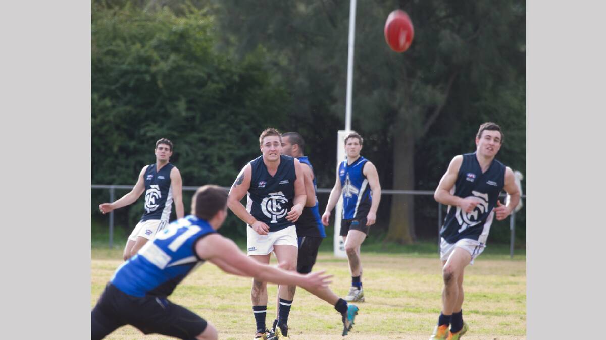  IN FORM: It is an exciting time in the Aussie rules club at the moment as the Blues go from strength to strength. They are backing up for their second home game on the trot and if they can bring some of the form from last weekend to their match against Goulburn they should be sitting pretty. Joel Pearson (centre), pictured during last Saturday’s game, has been a consistent performer all year. Watching on (left) is Tom Cronin and supporting (right) is Dylan McDermott. 
Photo: Mark Taber 
