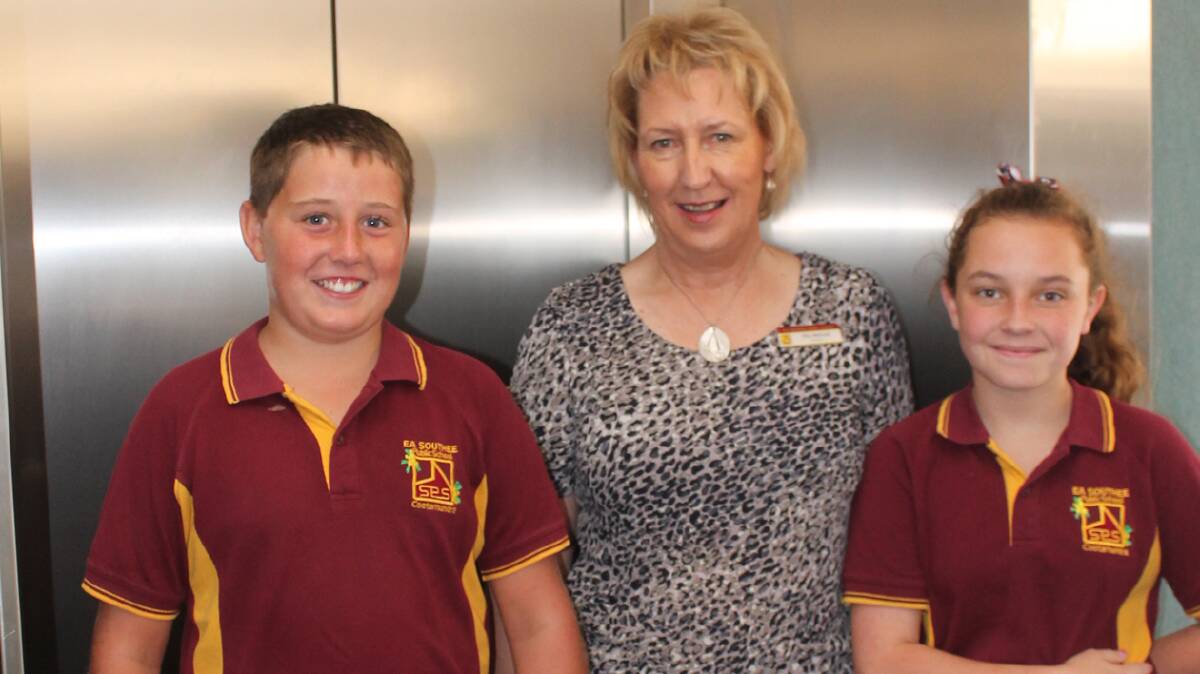 ACCESSIBLE: Pictured with the newly installed lift at EA Southee School are principal Zita McLeod and 2014 school captains Brendan Kelleher and Sophie McDermott.
