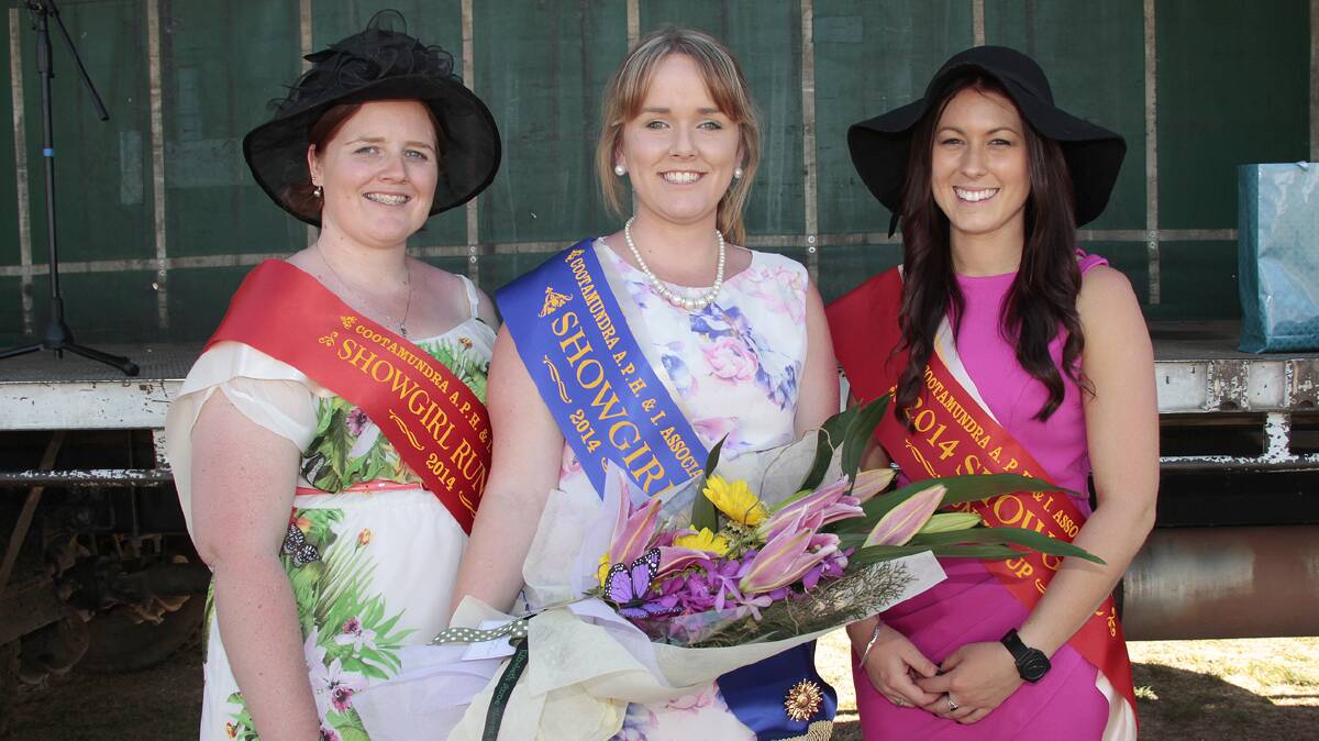 WITH PRIDE: Chloe Waters (centre) was named the 2014 Showgirl during Saturday’s official opening of the Cootamundra Show, with Tegan Everett (left) and Emily Fairley runners up. Chloe will now progress to zone judging. 
