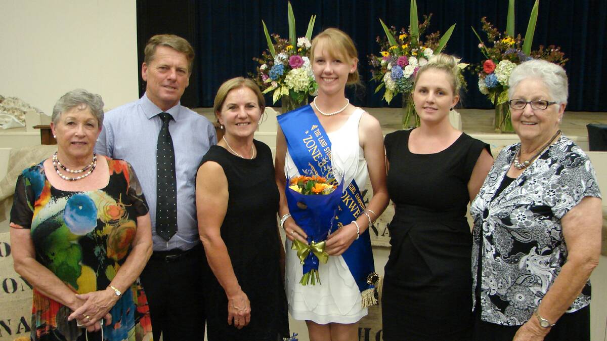  DESERVING WINNER: Bega Showgirl Brodie Chester (middle), formerly of Cootamundra, is congratulated on winning the Zone Three final in Crookwell on Saturday night by (from left) Barbara Ubrihien, Norm Pearce, Narelle Pearce, Jacinta Day and Marie Smith. 
Photo: Bega AP and H Society

