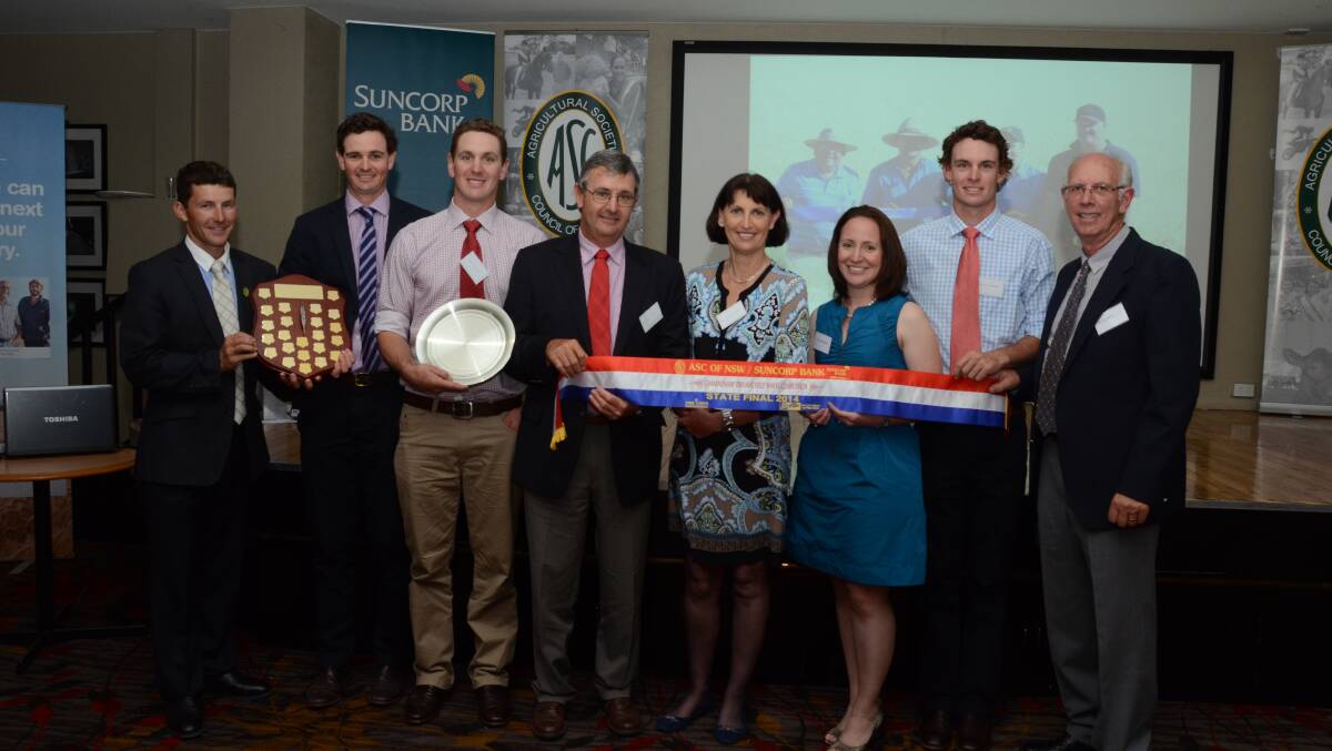  BEST IN STATE: Wallendbeen’s Hardie family have won the NSW Agricultural Societies Council dryland field wheat competition. Pictured is master of ceremonies Ian Pursehouse presenting the state shield to the Hardie family (from left) Grahame, Alex, Steve and Louanda, and Berkeley (second from right), with Suncorp Bank Albury district manager Clare Robinson and competition judge Paul Parker.