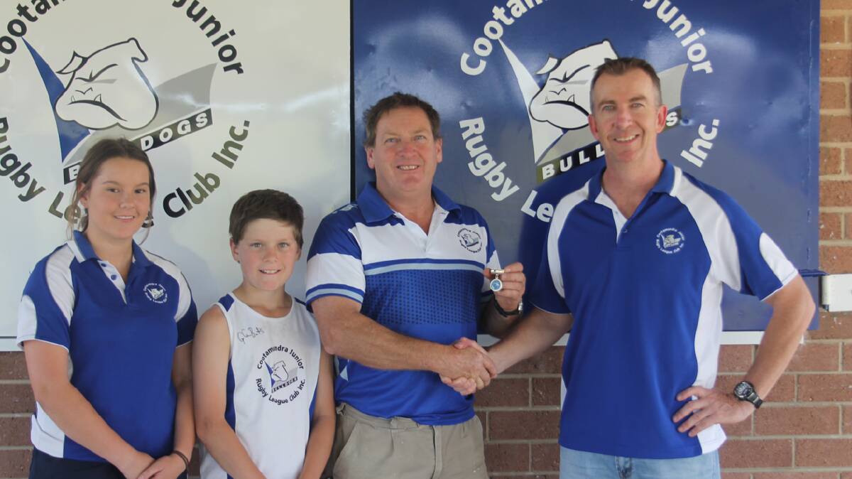 WELL DESERVED: It is because of his kids who play and have played junior league Jackson, Harry and Matilda that Gerard Duncombe does so much for the Cootamundra Junior Rugby League Club and his committment to the club was recognised recently when he was made a Life Member. Here he is pictured (second from right) with Junior League Club president Stephen Howse, Harry and Matilda.  