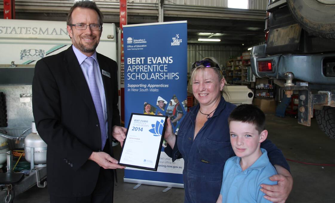 PROUD WINNERS: State Training Services Riverina manager Garry Whittaker presented Nicole Paxman with the Bert Evans apprentice scholarship on Thursday. Joining Nicole in receiving the award is her son Dennis Wheatley.
