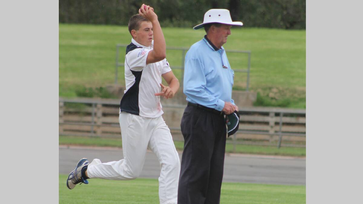 CHARGING IN: Country Club bowler Luke Levett prepares for delivery in his side’s match against Stock on the weekend as umpire Graeme Moon looks on. 
Photo: Melinda Chambers