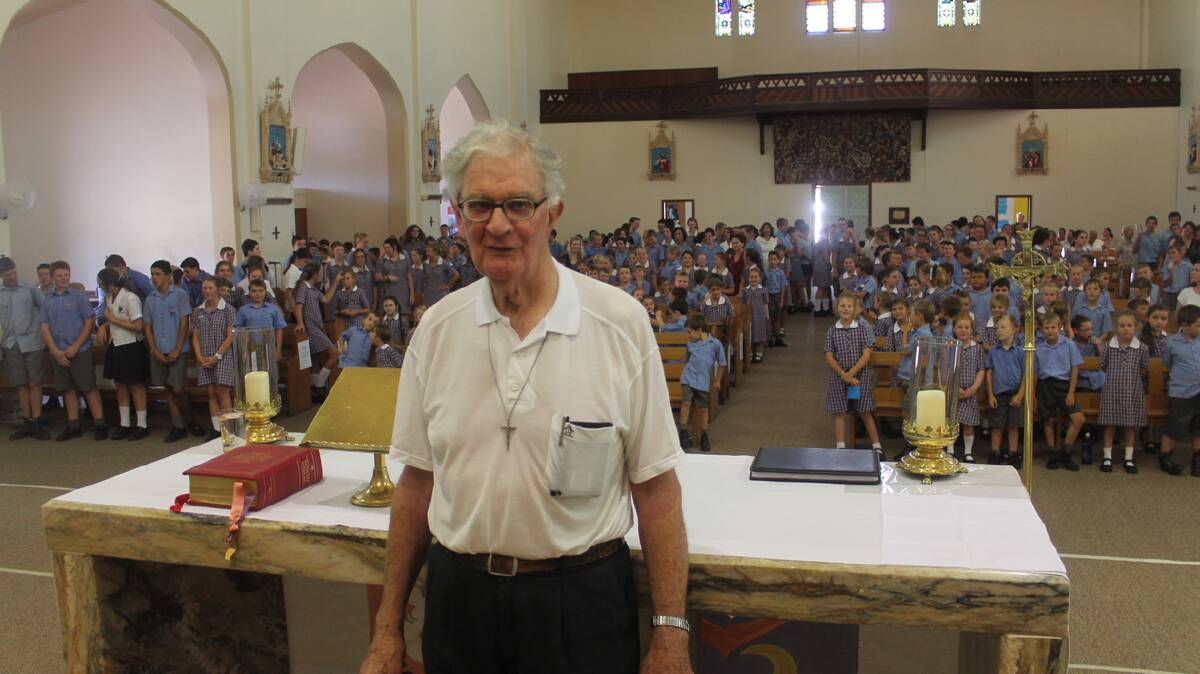 THANKYOU: Cootamundra Sacred Heart Central School students bid farewell to Father Kevin as their Parish Priest at a Mass held on Friday.