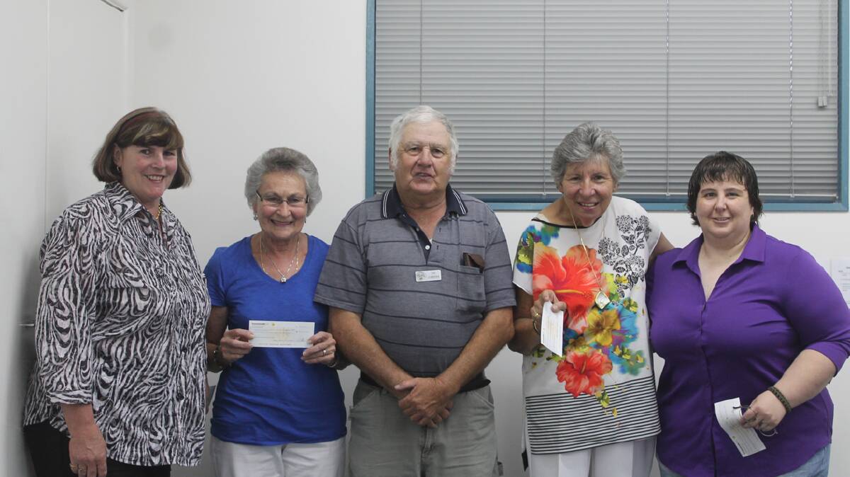 COOTAMUNDRA Antique Motor Club president Tim O’Keefe presents Cootamundra Nursing Home’s Annette Brien, Riding for the Disabled Doreen O’Connor, Cootamundra Hospital Auxiliary’s Jenny McClintock and CanAssist’s Tammy Thompson with a donation. 
