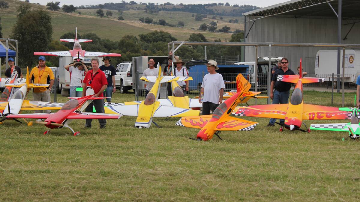  UP IN THE AIR: Pictured are scale modellers at a recent Cootamundra competition. This weekend will see a scale model acrobatic event at the Cootamundra Flying Field.