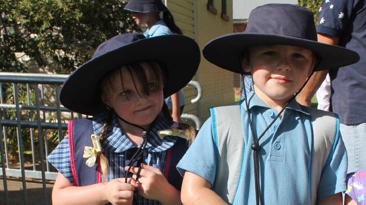 FIRST DAY: New Cootamundra Public School kindergarten students sister and brother Emily and Graham Percival are pictured before the start of school on Monday.