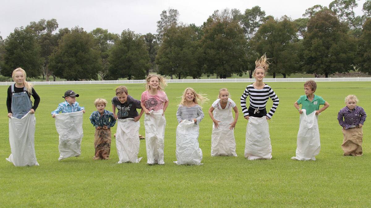 AND THEY’RE OFF: The sack race was a hoot for participants at the fair. 