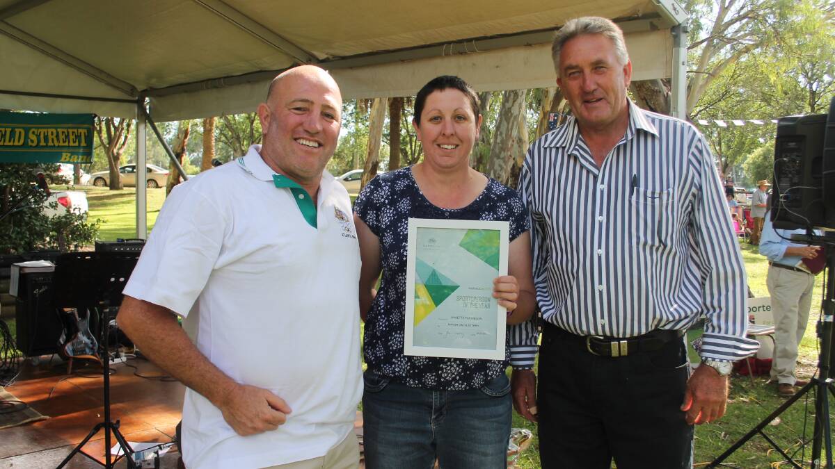 HAPPY AUSTRALIA DAY: Sportsperson of the Year Annette Parkinson (centre) received a pleasant surprise on Monday at Jubilee Park. Australia Day ambassador Rick Timperi (left) and Cootamundra deputy mayor Dennis Palmer handed over the award.