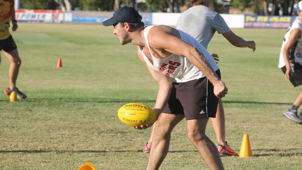 IN TRAINING: The Cootamundra Blues AFL Club trains last week under the guidance of new coach and player Luke Webb. The side has had good numbers turn up to training with everyone associated with the club confident of a strong season from the boys. 

Photo: Melinda Chambers 
