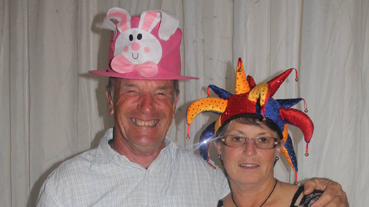 BEST HATS: Winners of the best hat section for the visitors at Friday night’s Veteran’s Week of Golf presentation dinner were Gordon Bray of Camden and Helen Pearce of Tumut. 
