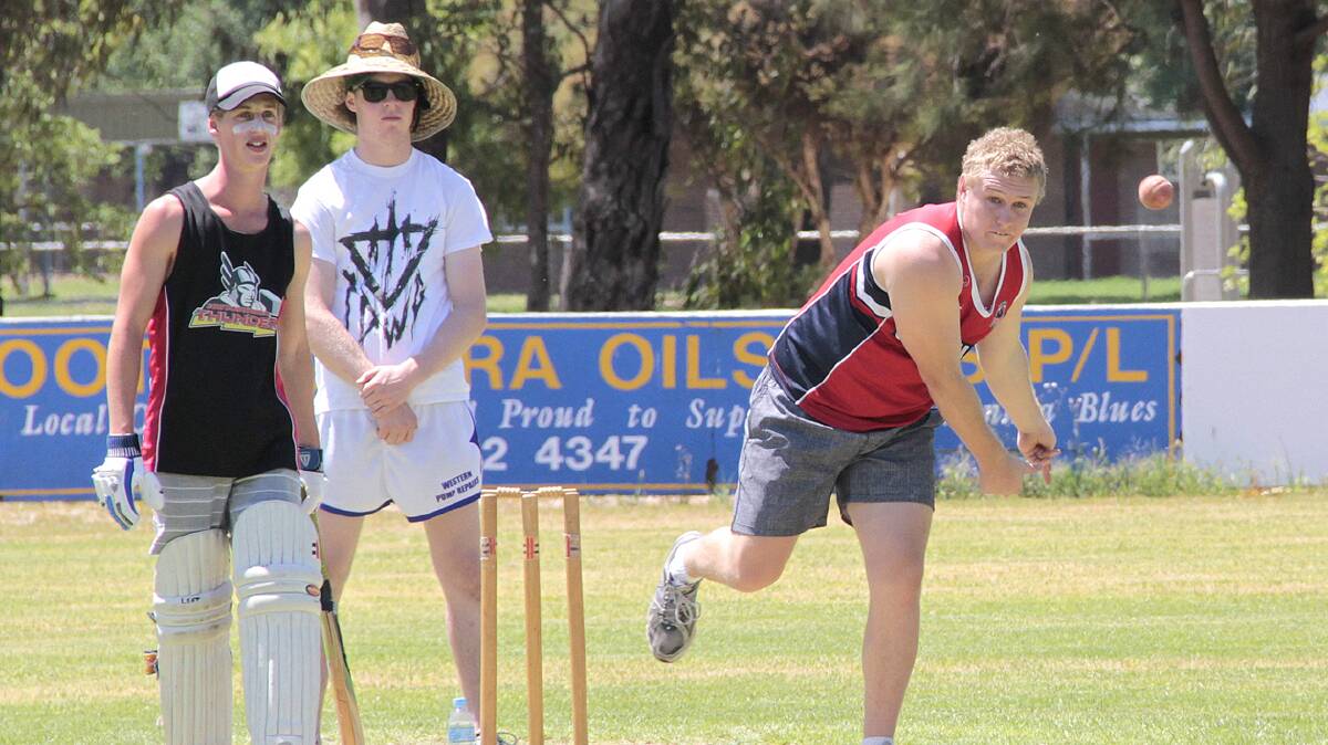   SENDING ONE DOWN: Pictured is Brad Piffero bowling in the recent seven side cricket tournament while Alex Jones (left) looks on. 
Photo: Kelly Manwaring
