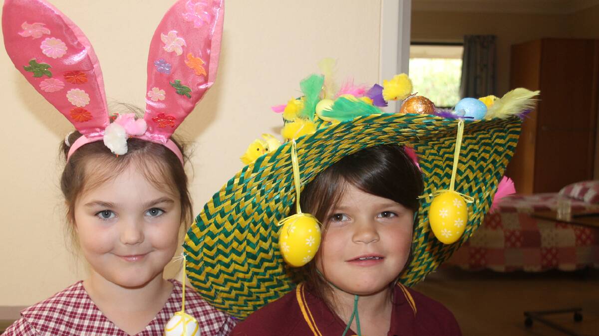  CREATIVE: EA Southee School took its Easter hat parade on the road to the Cootamundra Nursing Home last week. Pictured getting ready to perform are Emily Neilson and Charli Leggett.
