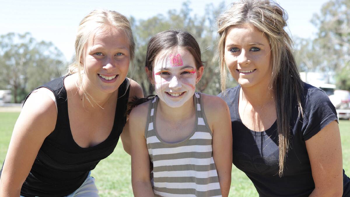  STOCK SPEEDSTERS: Following one of the races which formed part of the inaugural Redneck Games at last year’s Stockinbingal Village Fair are (from left) Kirrilee Cameron, Molly McCrone and Charlee McPherson. 