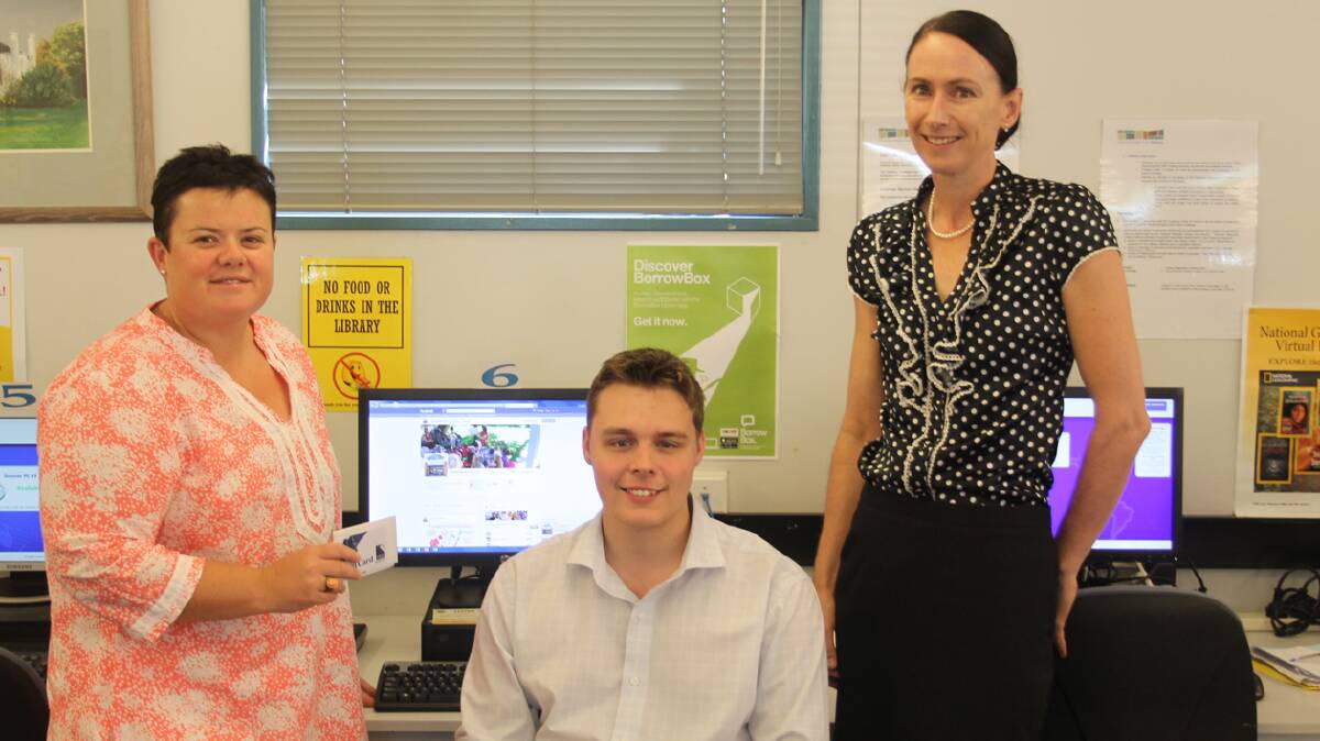  THE SOCIAL NETWORK: pictured (from left) are competition winner Kellie Johnson, Cootamundra Shire Council Information Technology trainee Aaron Black and Cootmaundra Library employee Rochelle Nicholls in front of the new Cootamundra Library Facebook page. The page was launched last week.