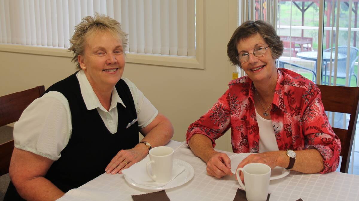  CHATTING: Enjoying a cup of tea at the “Shower” in Wattle Grove’s Boatshed community hall this week was Margaret Nixon and Chris Holland. Proceeds from the morning tea will go the Cootamundra Nursing Home Sprinkler Appeal.