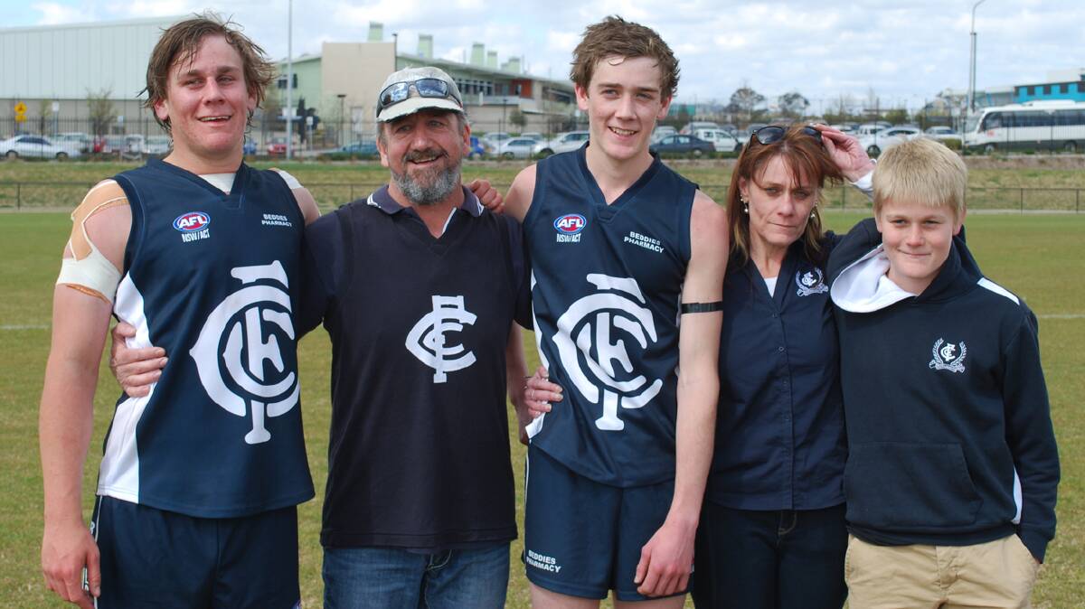  FAMILY AFFAIR: How proud were parents Wayne and Shelly Johnston and youngest brother Adam when brothers Toby and Luke took to the field in the Blues grand final this year. Amazing moment for the family and one to cherish. Pictured (from left) are Toby, Wayne, Luke, Shelly and Adam. 

Photo: Mark Loiterton 